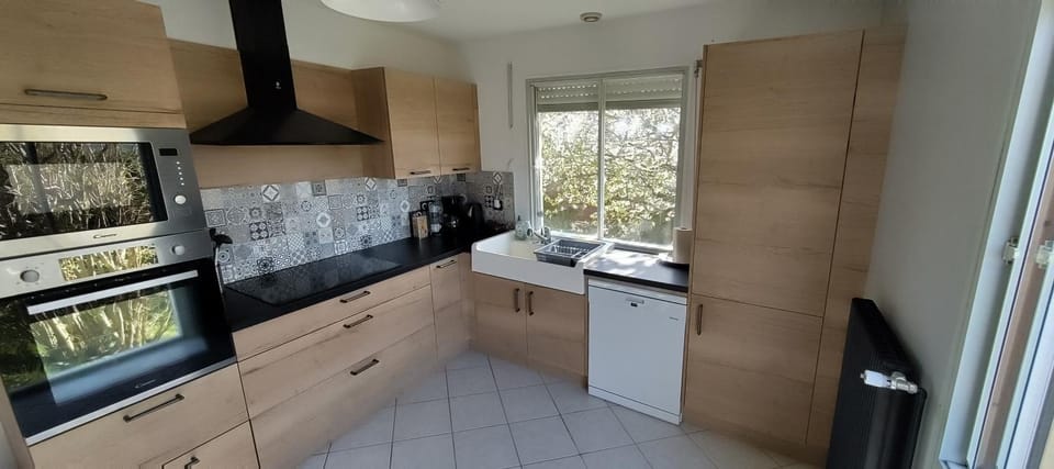 Kitchen or kitchenette, dishwasher, oven, stove