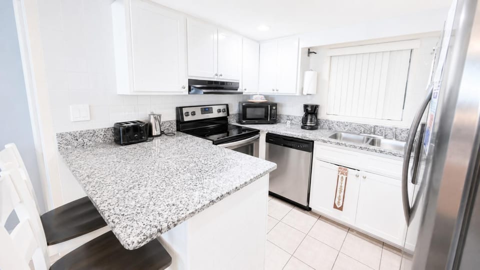 Kitchen or kitchenette, Dining area, dishwasher, oven, stove, toaster