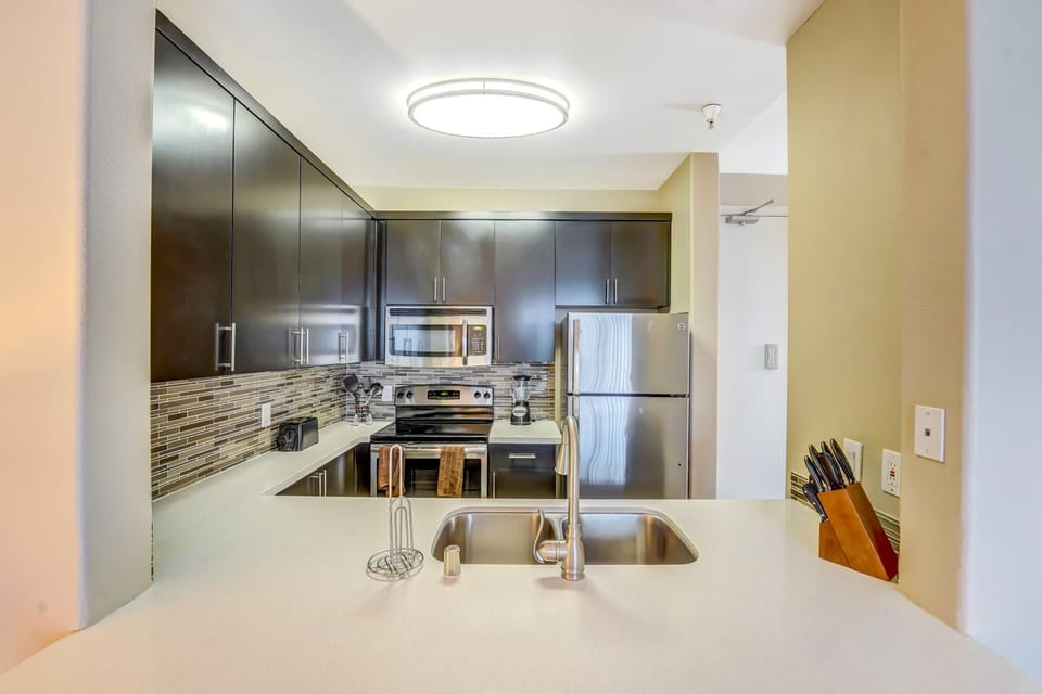 Kitchen or kitchenette, dishwasher, oven, stove