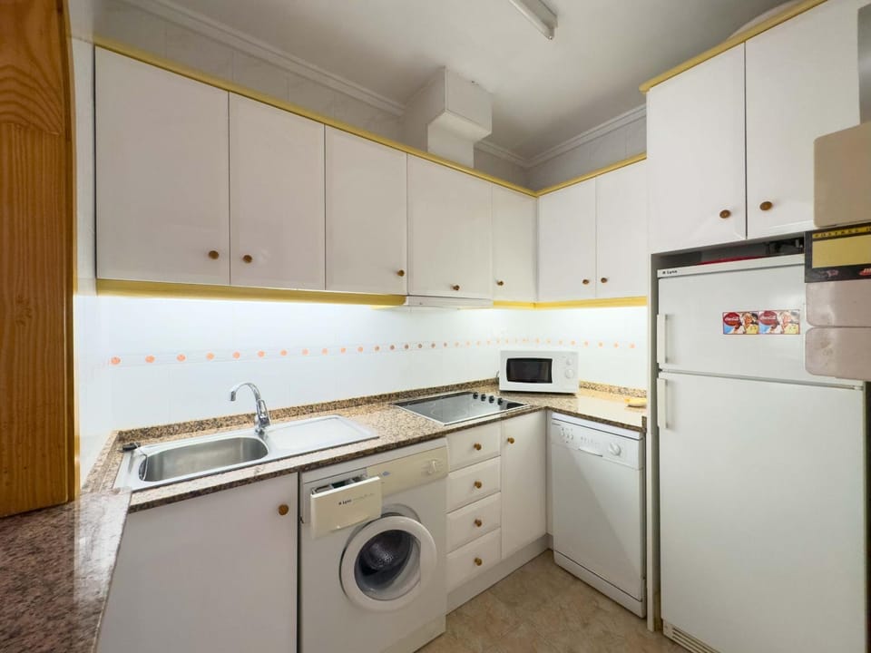 Kitchen or kitchenette, dishwasher, stove, washing machine