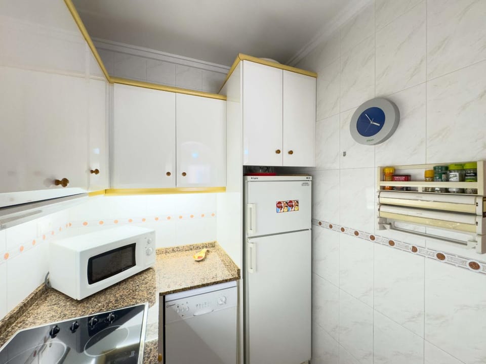 Kitchen or kitchenette, dishwasher, stove