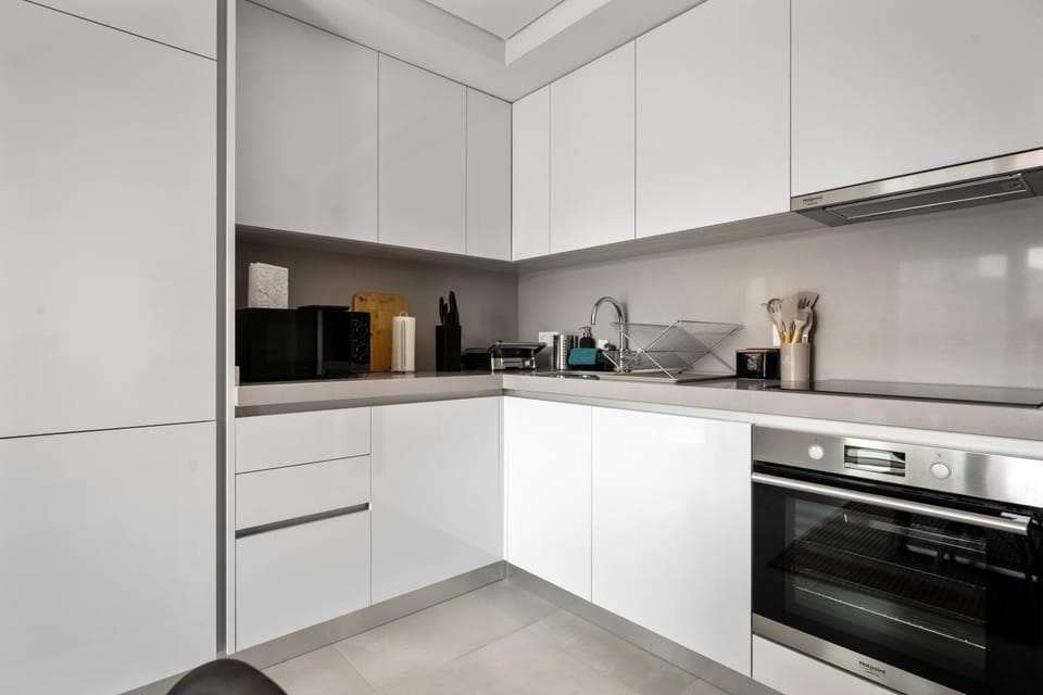 Kitchen or kitchenette, dishwasher, oven, stove, toaster