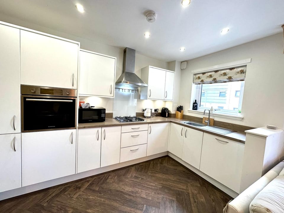 Kitchen or kitchenette, dishwasher, oven, stove, toaster