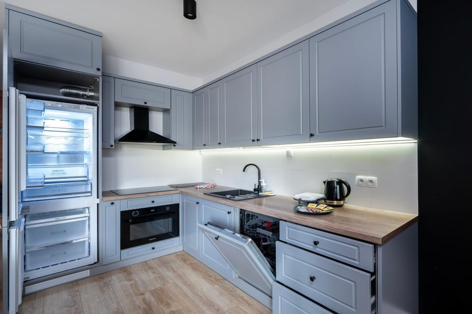 Kitchen or kitchenette, dishwasher, oven, stove, toaster