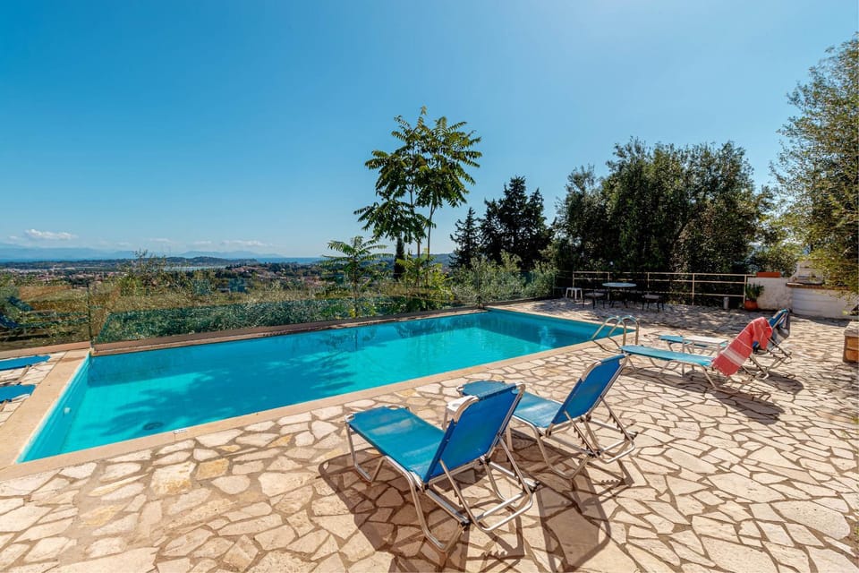 Patio, Day, Natural landscape, Pool view, Swimming pool, sunbed