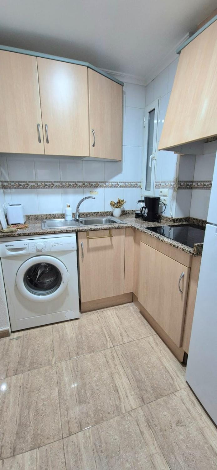 Kitchen or kitchenette, stove, washing machine