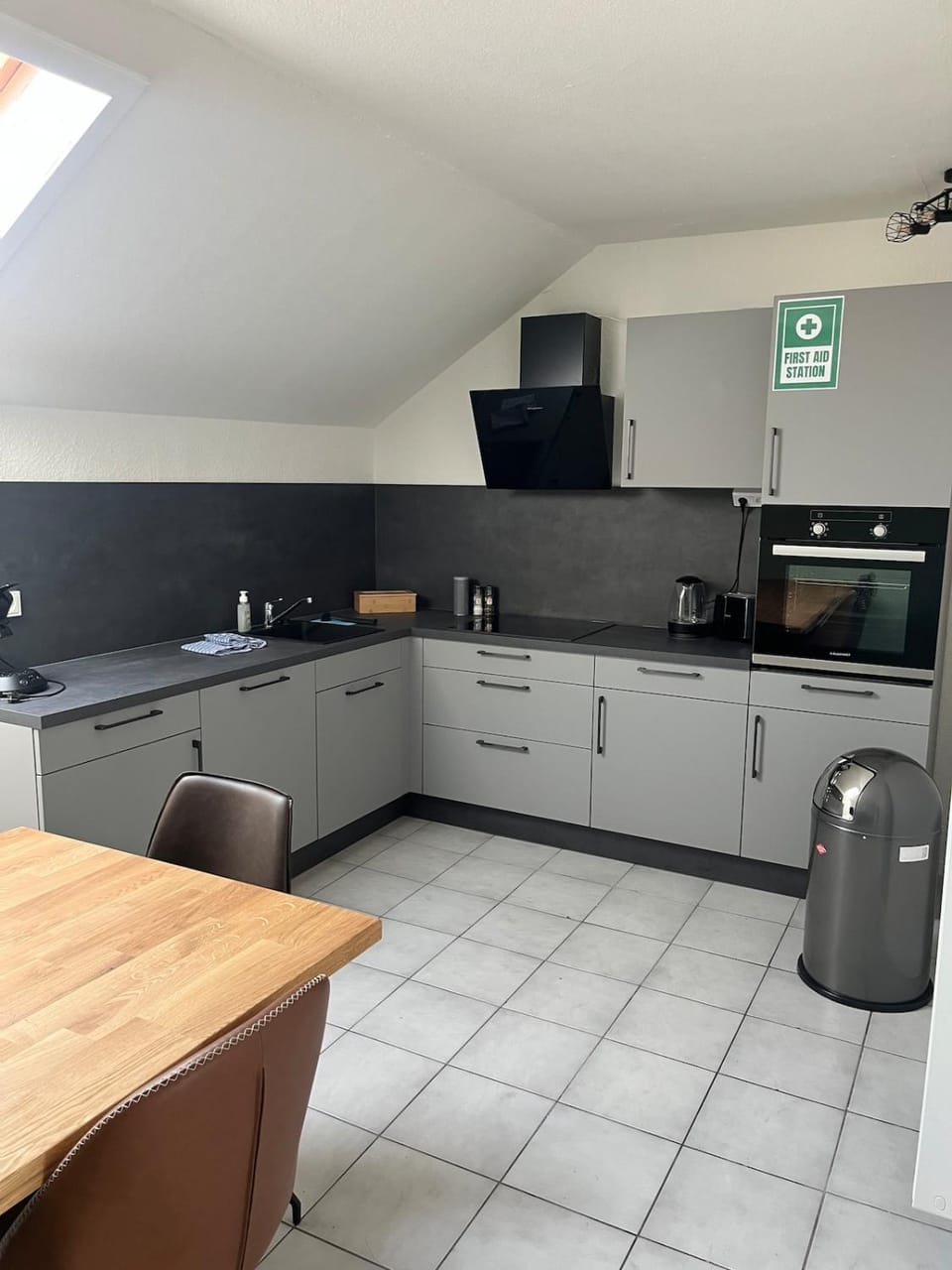 Kitchen or kitchenette, dishwasher, oven, stove