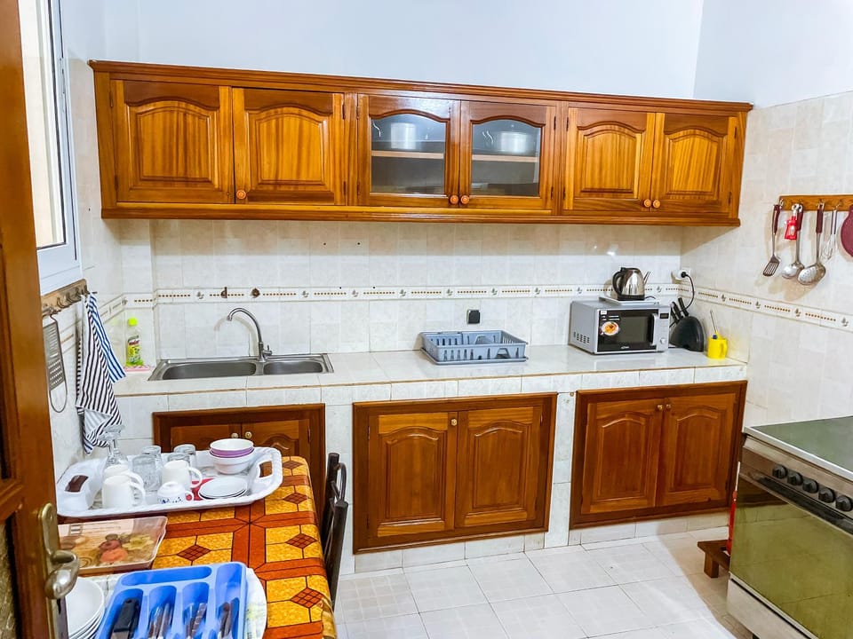 Kitchen or kitchenette, dishwasher, oven, stove