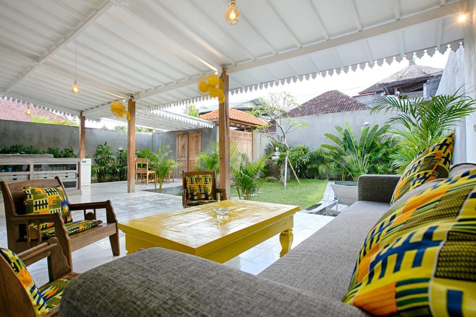 Living room, Seating area, Garden view, Pool view
