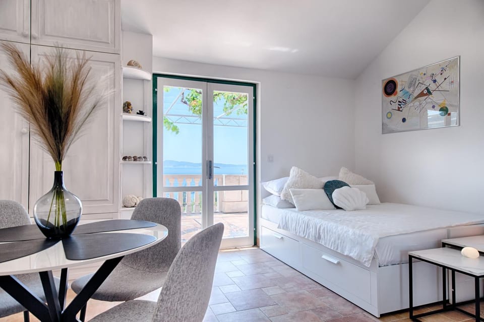 Bed, Natural landscape, Dining area, Bedroom, Sea view