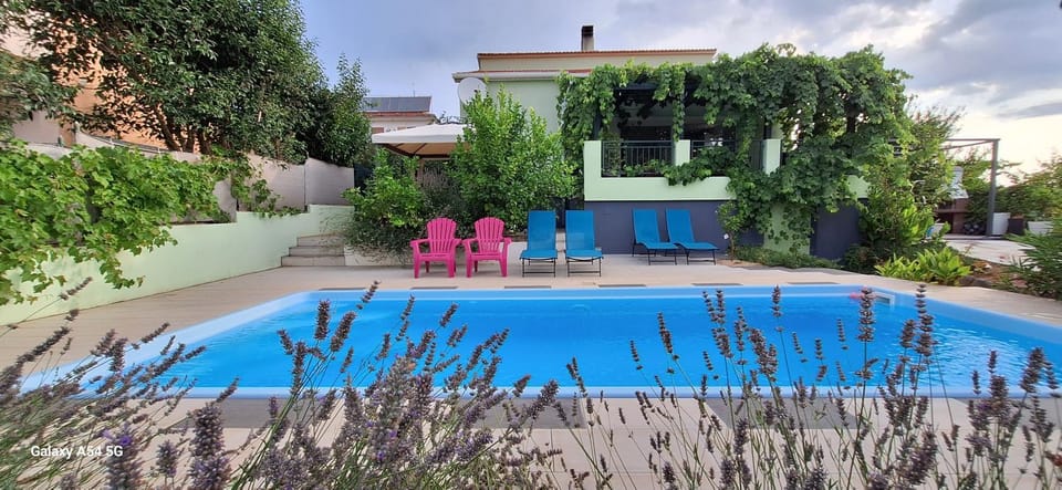 Property building, Day, Pool view, Swimming pool, sunbed
