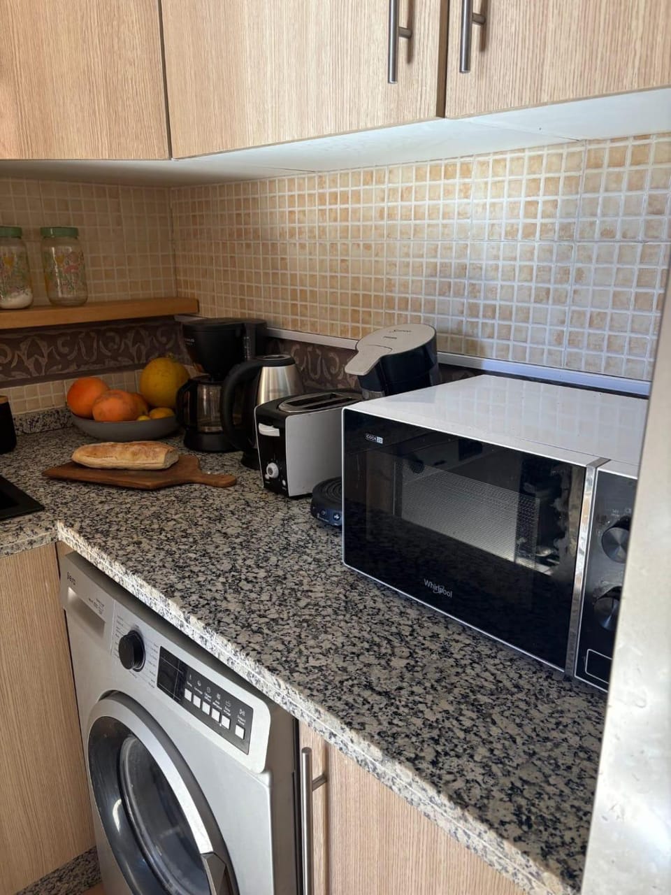 Kitchen or kitchenette, toaster, washing machine