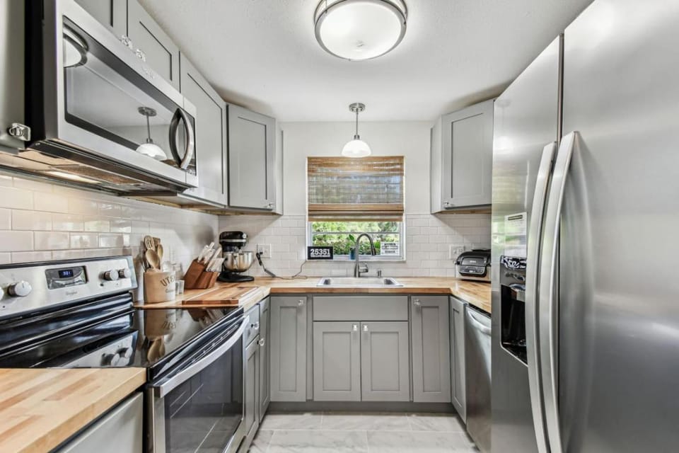 Kitchen or kitchenette, dishwasher, oven, stove, toaster