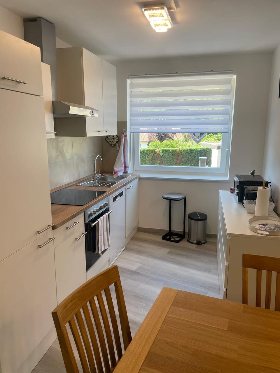 Kitchen or kitchenette, dishwasher, oven, stove