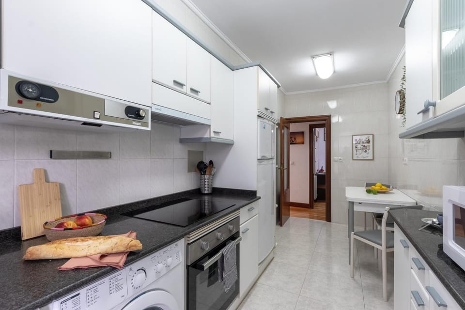 Kitchen or kitchenette, stove, washing machine