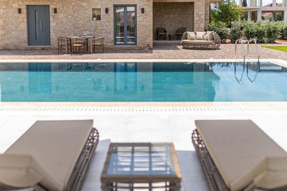 Property building, Seating area, Pool view, Swimming pool, sunbed