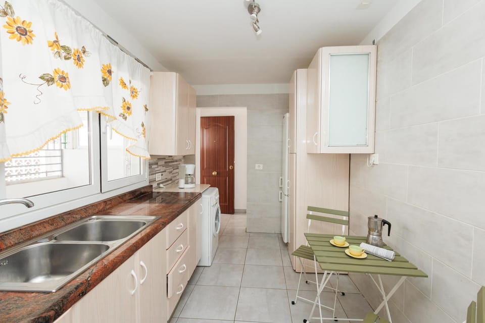 Kitchen or kitchenette, stove, washing machine