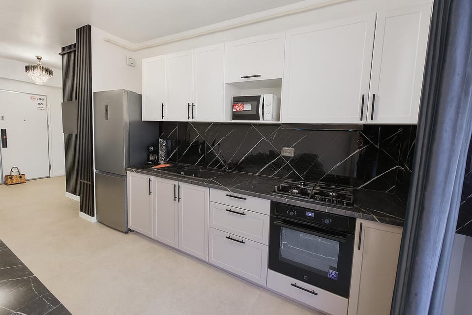 Coffee/tea facilities, Kitchen or kitchenette, dishwasher, microwave, oven, stove, toaster, washing machine