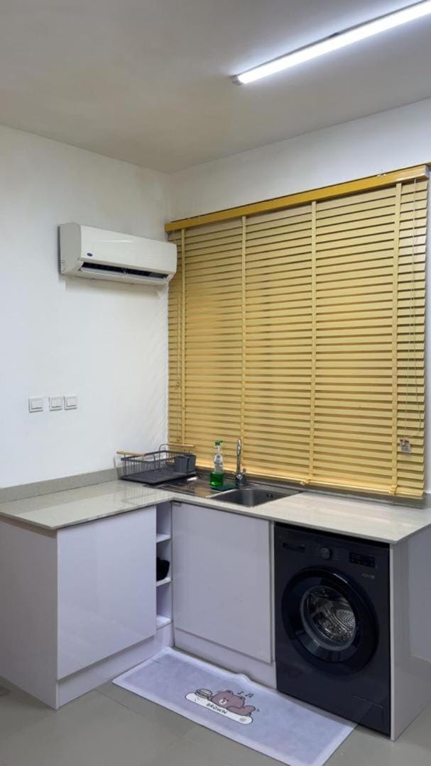Kitchen or kitchenette, washing machine