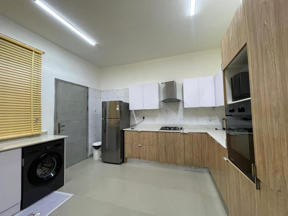 Kitchen or kitchenette, washing machine