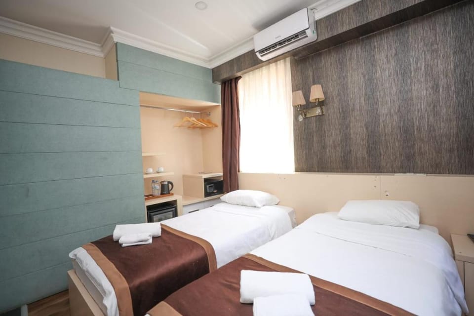 Bed, Photo of the whole room, Bedroom, towels, air conditioner