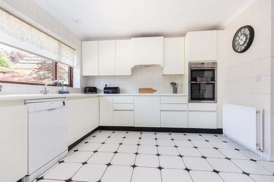 Kitchen or kitchenette, dishwasher, stove, toaster