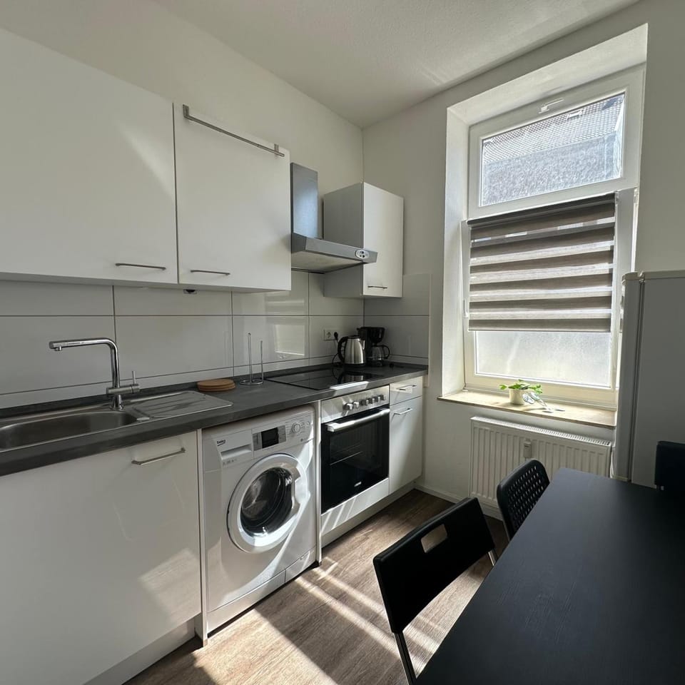 Kitchen or kitchenette, stove, washing machine