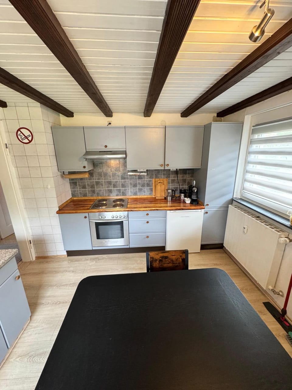 Kitchen or kitchenette, dishwasher, oven, stove