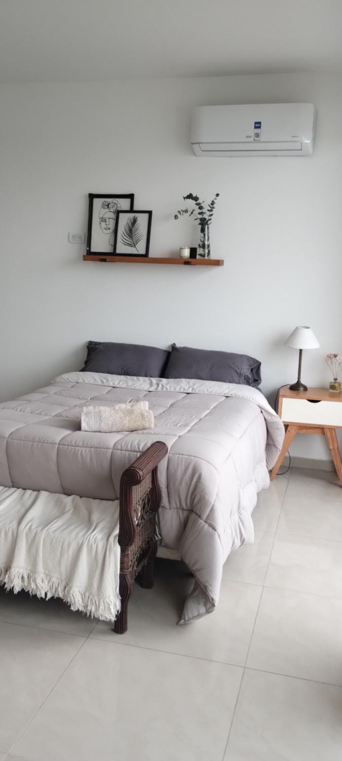 Bed, towels, air conditioner