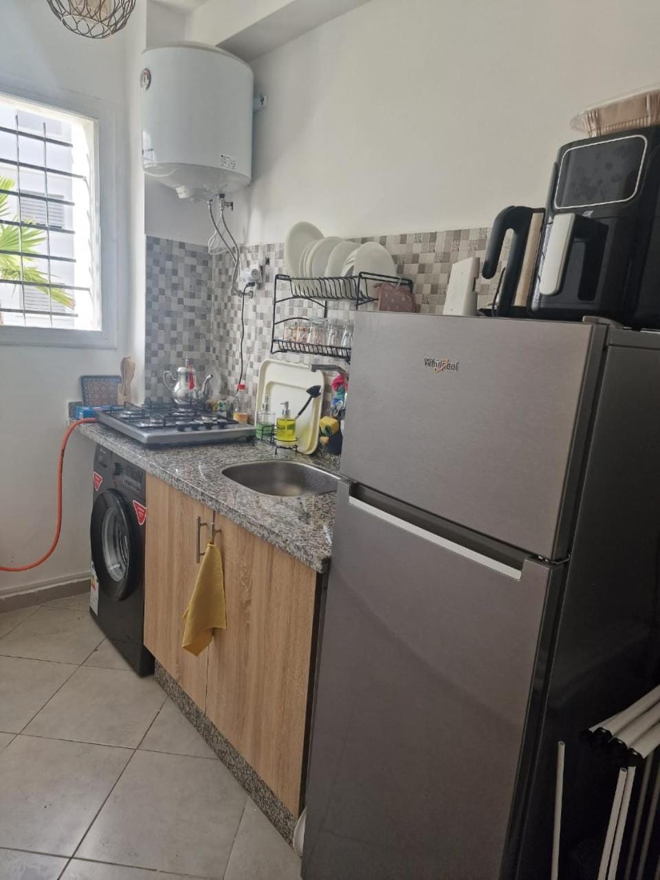 Kitchen or kitchenette, oven, stove, washing machine