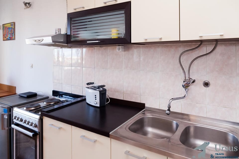 Kitchen or kitchenette, stove, toaster