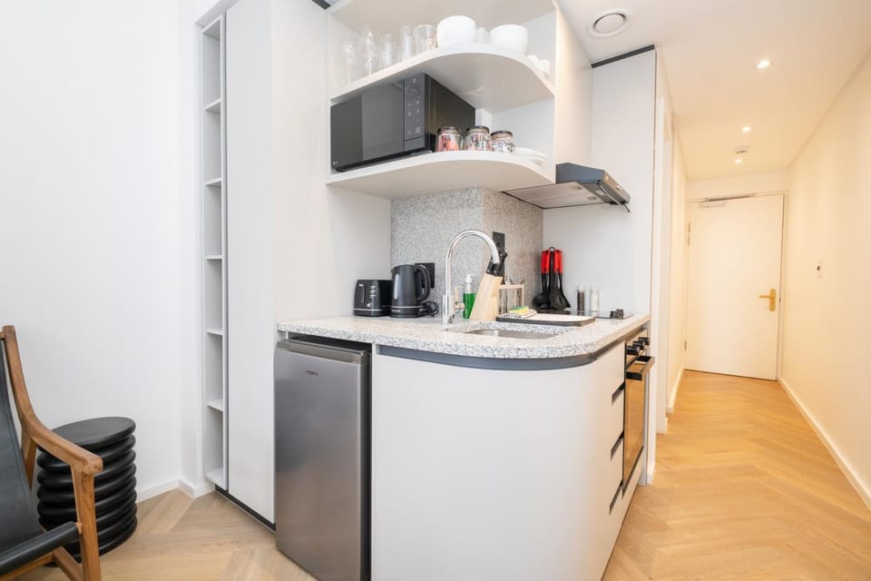 Kitchen or kitchenette, microwave, oven, stove, toaster
