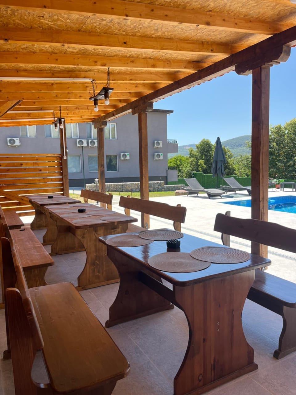 Patio, Day, Natural landscape, Pool view, Swimming pool, sunbed