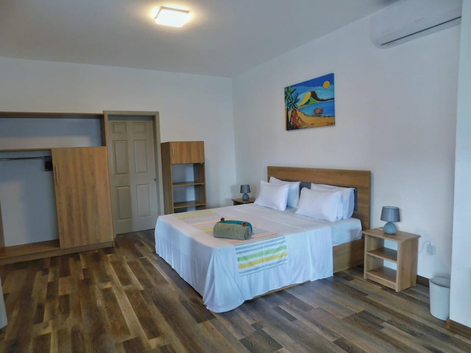 Bed, towels, wardrobe