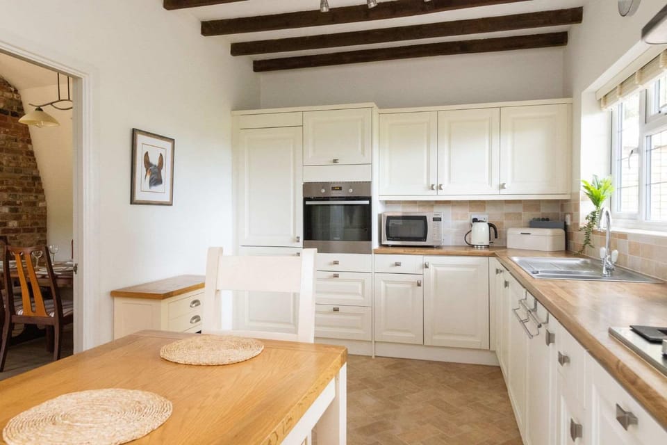Kitchen or kitchenette, dishwasher, oven, stove, toaster