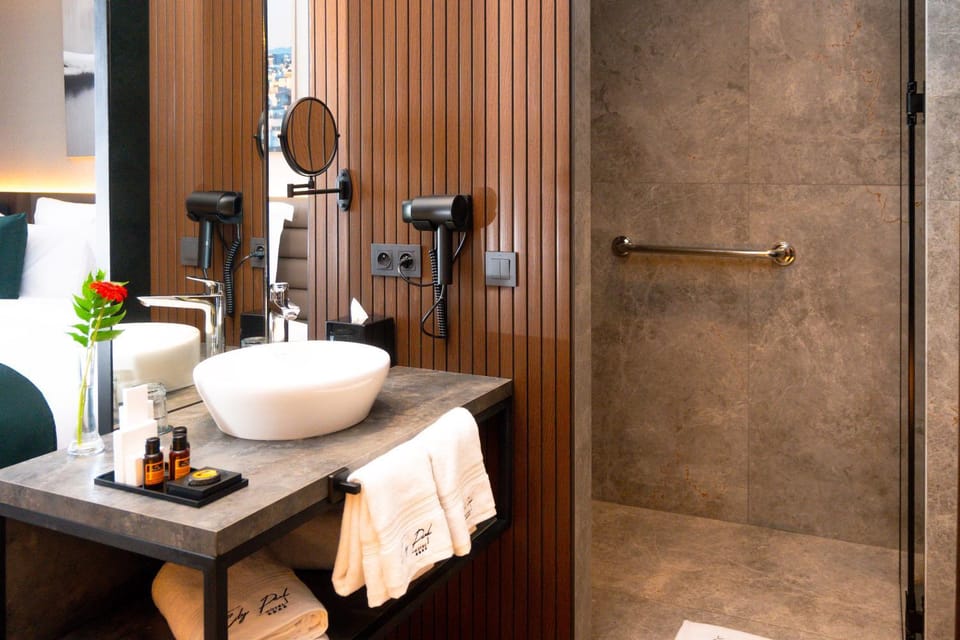 Shower, Toilet, Bathroom, hair dryier, towels, wardrobe