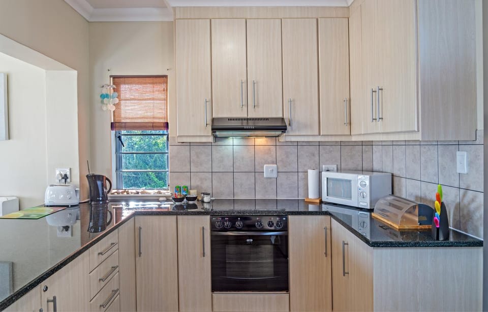 Kitchen or kitchenette, microwave, oven, stove, toaster