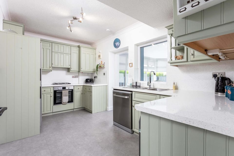 Kitchen or kitchenette, dishwasher, oven, stove, toaster