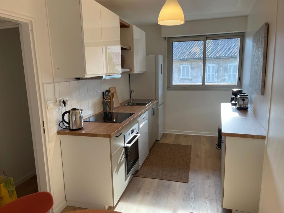 Kitchen or kitchenette, dishwasher, oven, stove, toaster