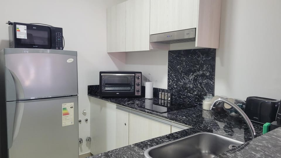 Kitchen or kitchenette, oven, stove, toaster
