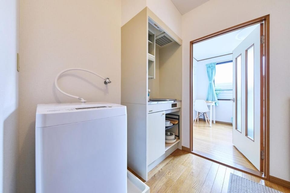 Kitchen or kitchenette, washing machine