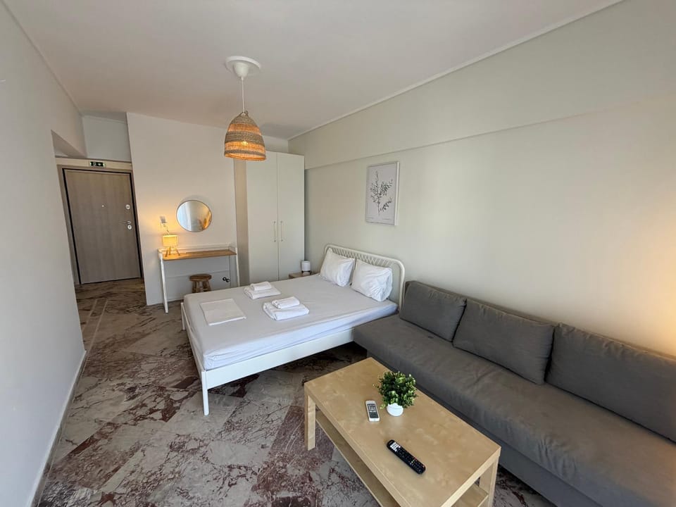 Bed, Seating area, towels, wardrobe