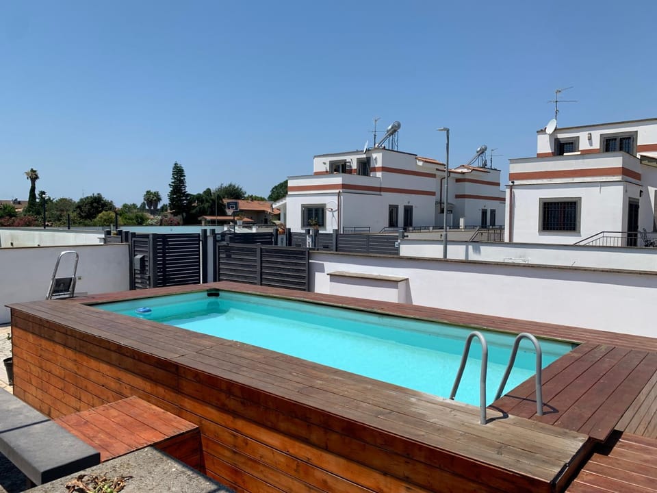 Property building, Patio, Day, View (from property/room), Balcony/Terrace, Pool view, Swimming pool, Swimming pool, Open Air Bath, sunbed