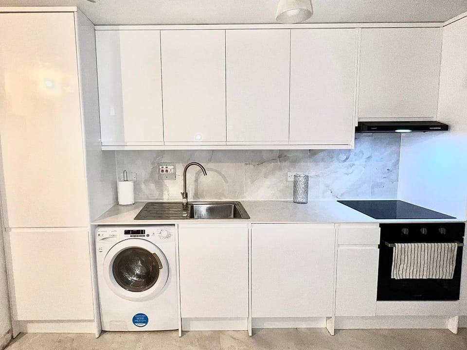 Kitchen or kitchenette, dishwasher, oven, stove, washing machine, dryer