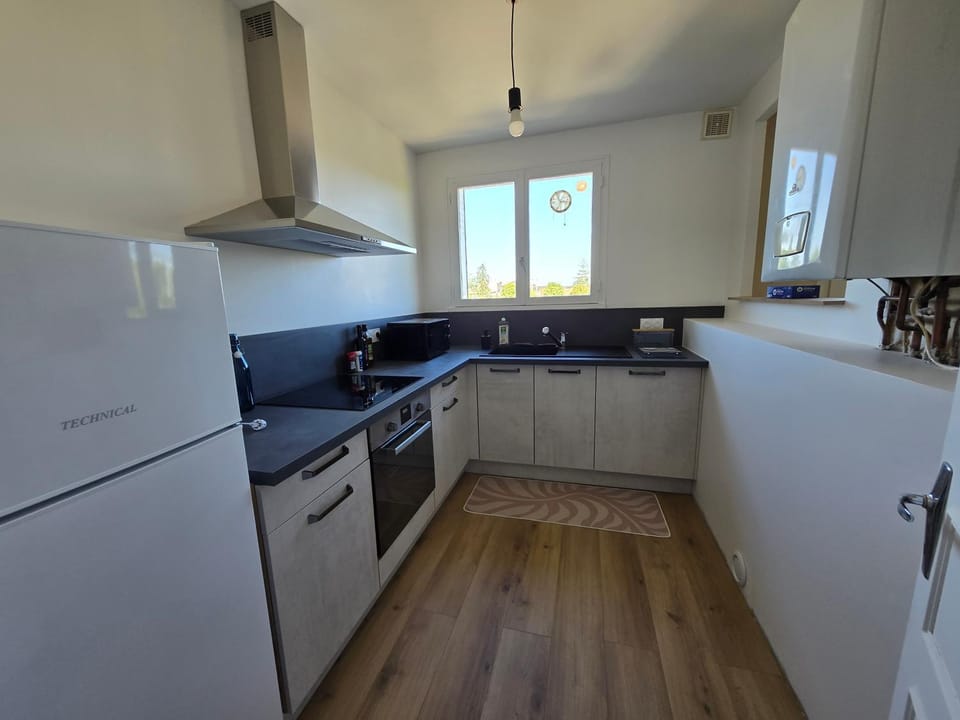 Kitchen or kitchenette, dishwasher, oven, stove