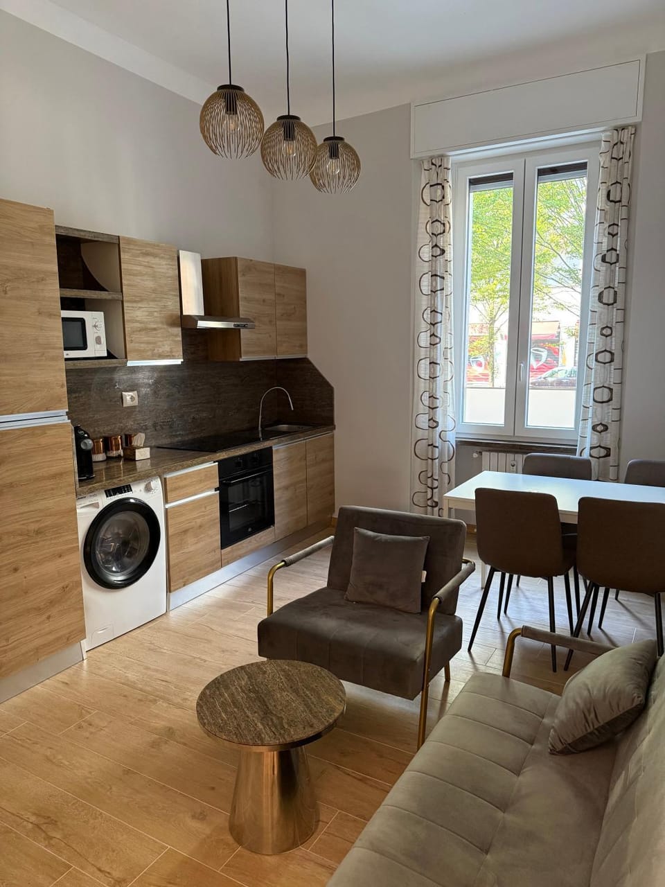 Kitchen or kitchenette, Living room, Seating area, Dining area, dishwasher, oven, stove, washing machine, dryer