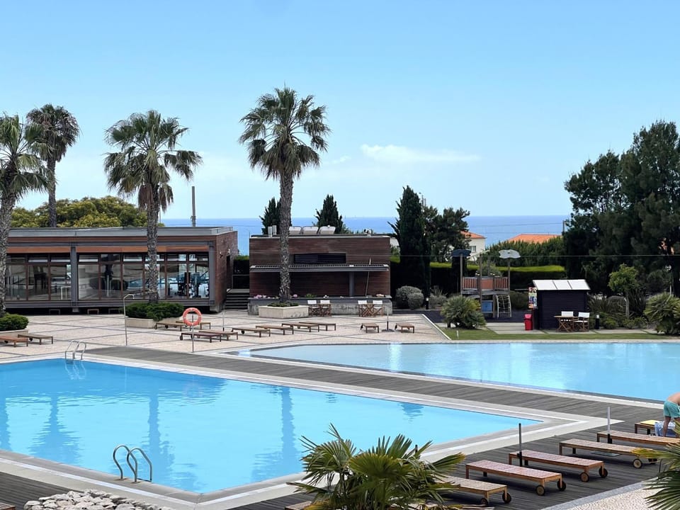 Property building, Day, Natural landscape, Pool view, Swimming pool, sunbed