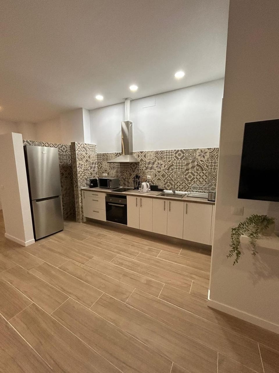 Kitchen or kitchenette, dishwasher, oven, stove