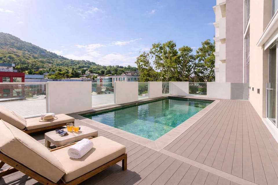 Property building, Patio, Natural landscape, View (from property/room), Balcony/Terrace, Mountain view, Pool view, Swimming pool, sunbed