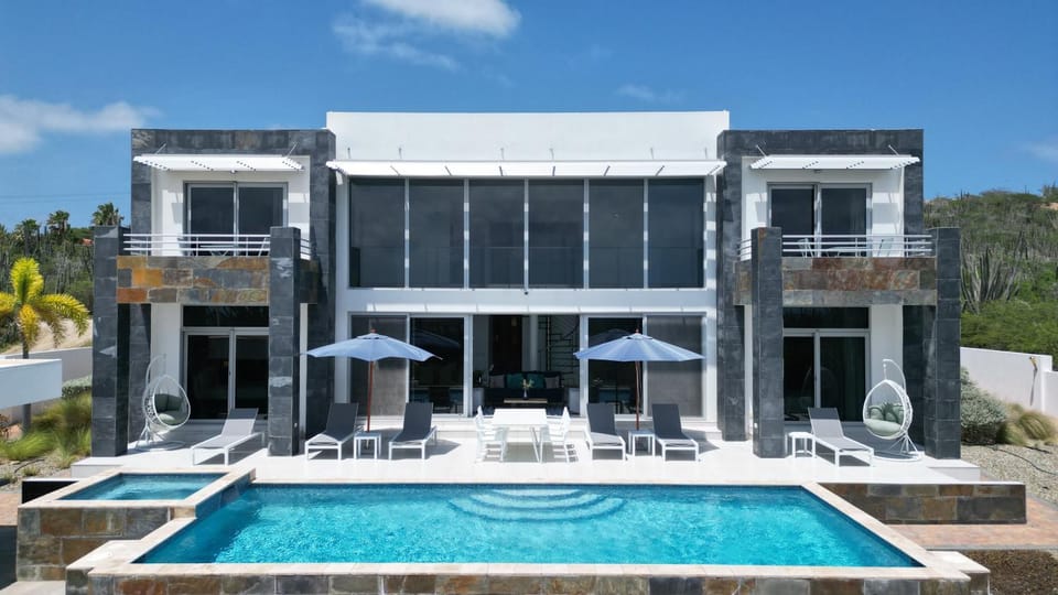 Property building, Patio, Pool view, Swimming pool, sunbed